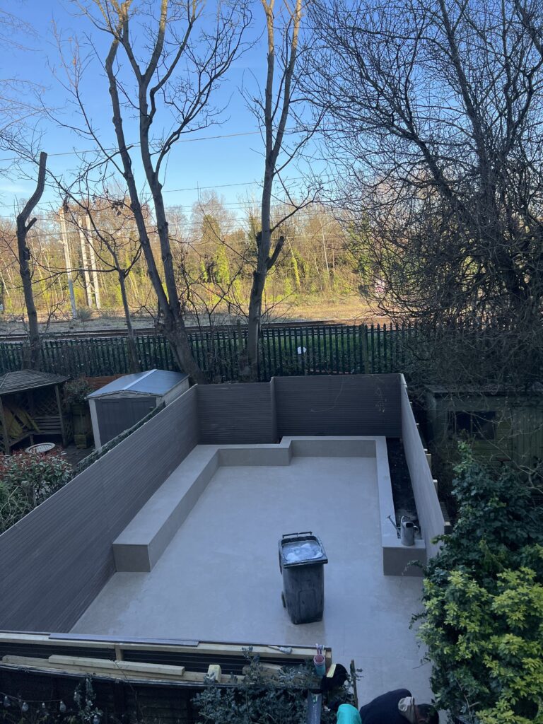 Steel-reinforced concrete sub-base being poured for a durable and level luxury patio in Finsbury Park.